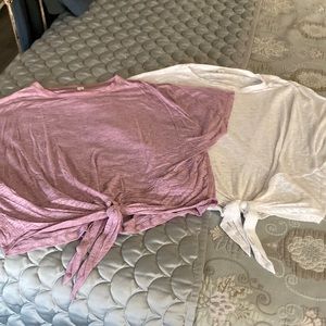 2 cropped Lululemon mauve and white tie front tops. Can be bought separately.